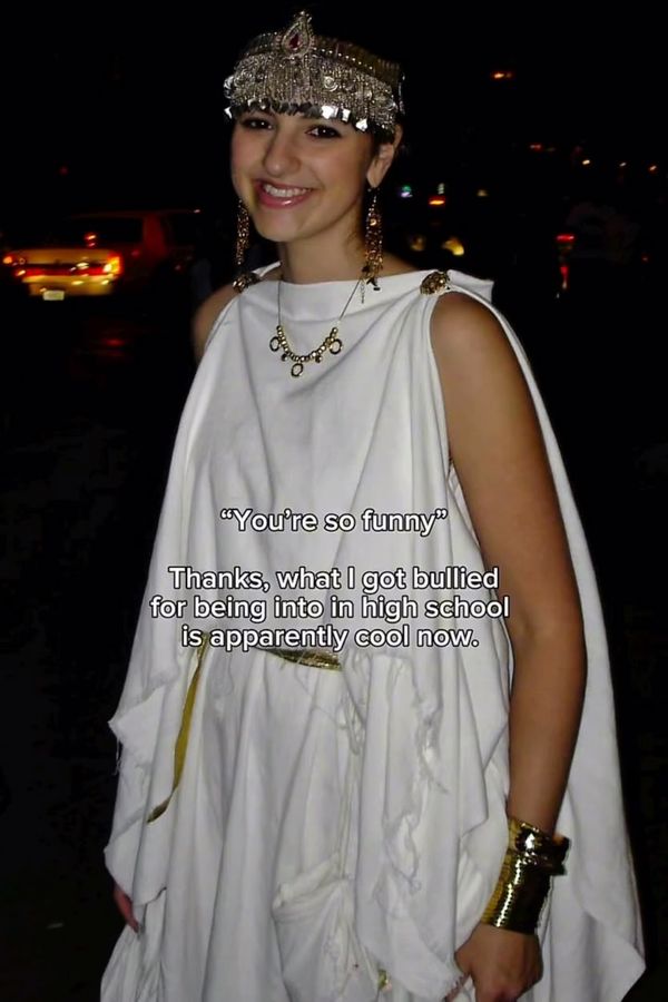 Andrea as Cassandra of Troy in a white draped costume and headpiece