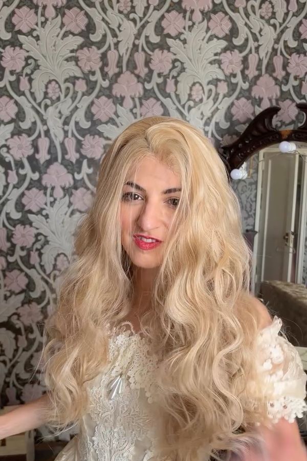 Andrea in a blonde wig and white LaceMade dress as Teri Polo's Christine from the 1990 TV series