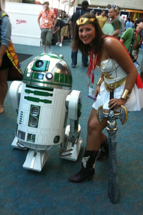 Andrea in costume at San Diego Comic-Con next to an R2-D2